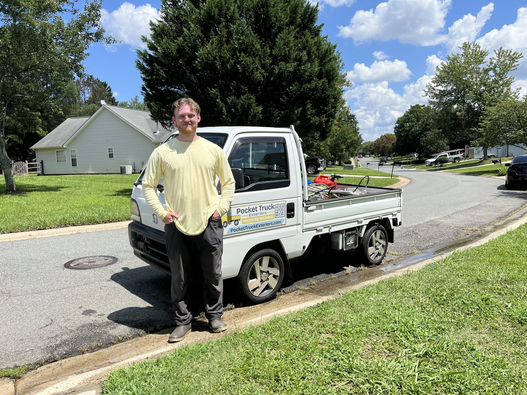 Owner of Pocket Truck Exteriors standing with the branded Pocket Truck